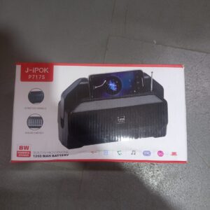 Portable speaker with a built-in solar panel for charging and a phone stand function.